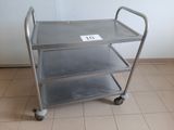 a metal cart that has a sign on the side of it