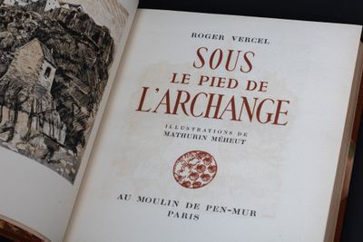 an open book with a picture of a village on it