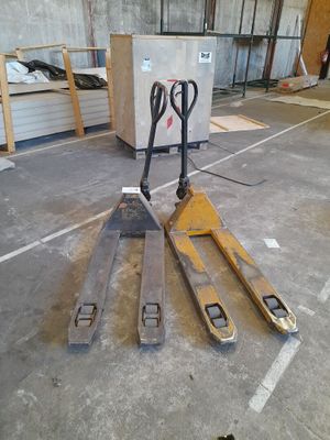 a forklift that is sitting in the middle of the floor