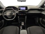 the interior of a small car with a steering wheel and dashboard