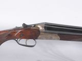 a close up of a gun on display in a glass case