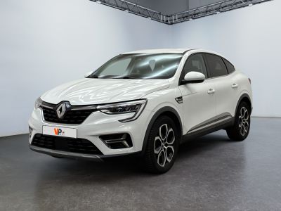 a white car is parked in a white room with a black floor