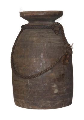 a large brown vase with a rope around it