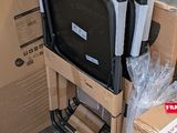 a stack of chairs sitting on top of boxes in a room