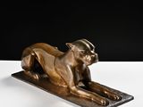 bronze statue of a cat with a hat on its head