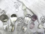 a lot of glass spoons and spoon spoons on a table