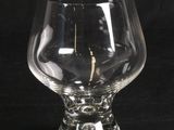 a glass that has a candle inside of it