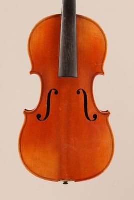 an old violin with a bow hanging from it ' s back