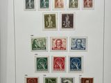 an image of a picture of a collection of stamps on a wall