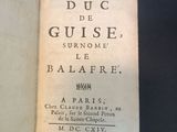 a book open on a table with a black background