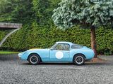 an image of a blue sports car parked in a parking lot