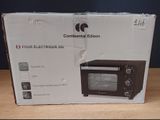 packaging for a four - slice toaster oven sitting on a wooden table