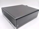 an image of a black computer on a white surface