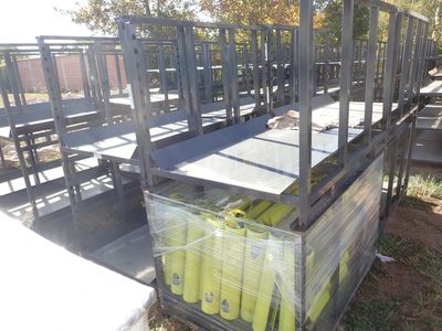 boxes of tennis balls are stacked on top of a pallet