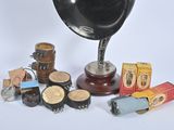 a black and white photo of an old gramphone and other items