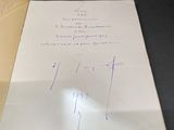 an open book with writing on it sitting on a table