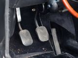 two pedals that are sitting on the floor of a car