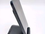a close up of a cell phone on a stand