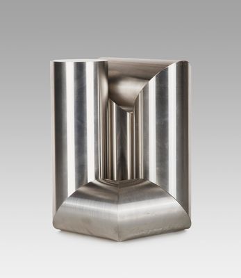 a close up of a metal object on a white background