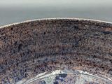 a close up of a bowl with a brown and black glaze