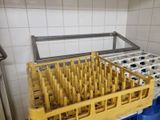 a rack with a bunch of empty milk bottles in it
