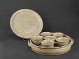 a bowl and a plate that are sitting on a table