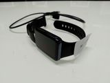 a close up of a smart watch sitting on a table