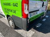 a green and white van parked on the side of the road