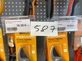 many different types of pliers on display in a store