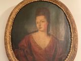 a painting of a woman in a red dress hanging on a wall