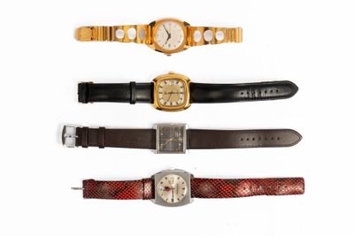 four different types of watches are displayed on a white surface