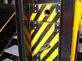 a black and yellow door with a yellow and black stripe on it