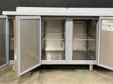 an open refrigerator with a lot of shelves inside of it