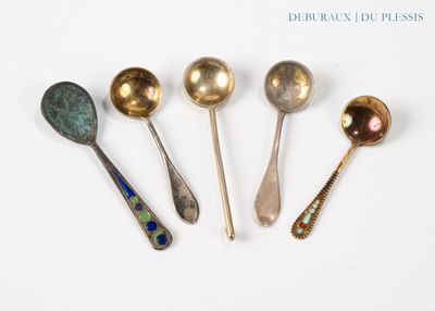 six spoons are lined up in a row on a white surface