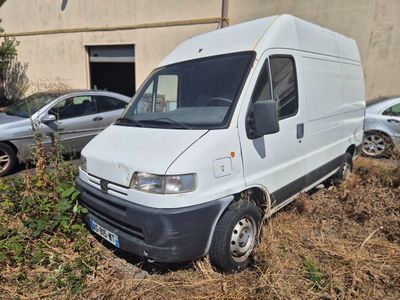 a white van that is parked in the grass
