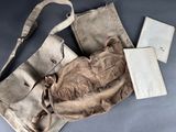 a bag and a pair of scissors sitting on a table