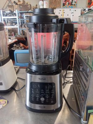 a blender sitting on a counter in a kitchen