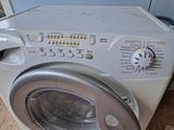 a washing machine that is sitting on the floor