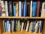 a book shelf with many books on it in a room