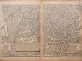 an old map of a city in a book on a table
