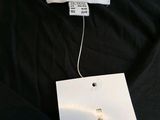 a close up of a black shirt with a white tag on it