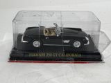 a black model of a car in a clear case