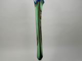 a glass vase that has a blue flower in it