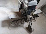 a small machine that is sitting in a garage