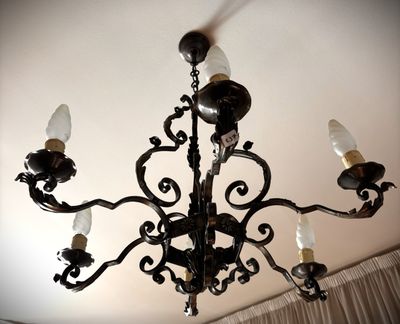 a chandelier that has a lot of lights hanging from it