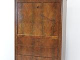 a wooden cabinet with a marble top on wheels