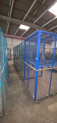 many cages that are in a building that is empty