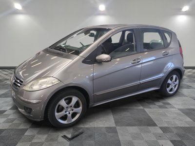 a picture of a silver car parked in a garage