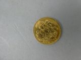 a gold coin with a picture of a man riding a horse