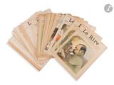 a stack of old french newspapers on a white surface